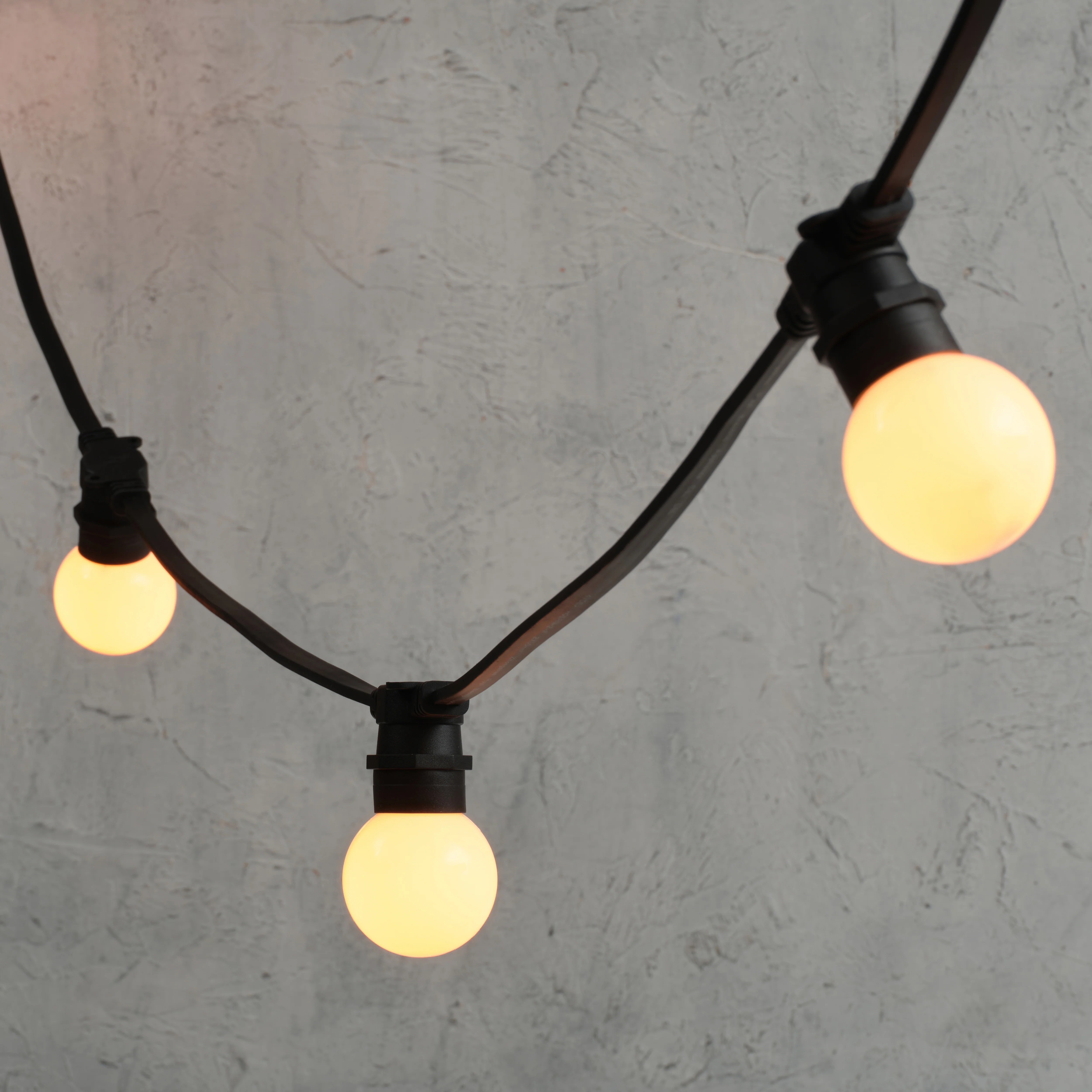 Plus Connect 10m 20 Warm White Connectable Festoon Lights G60 Bulb Frosted Cap Black Cable